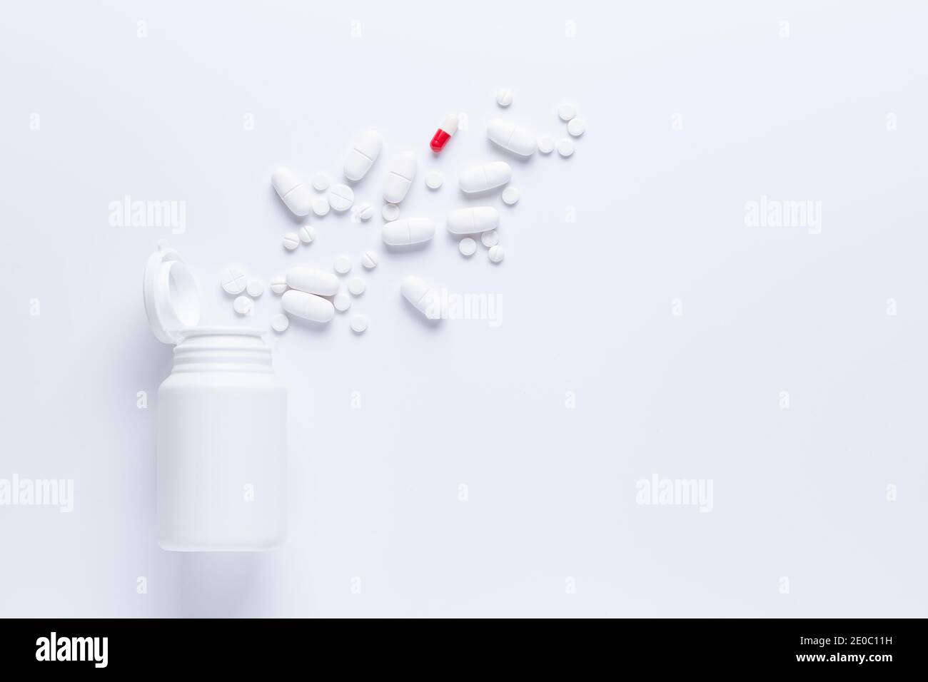 Spilled Pill Bottle isolated.Top view, pharmacology concept. white