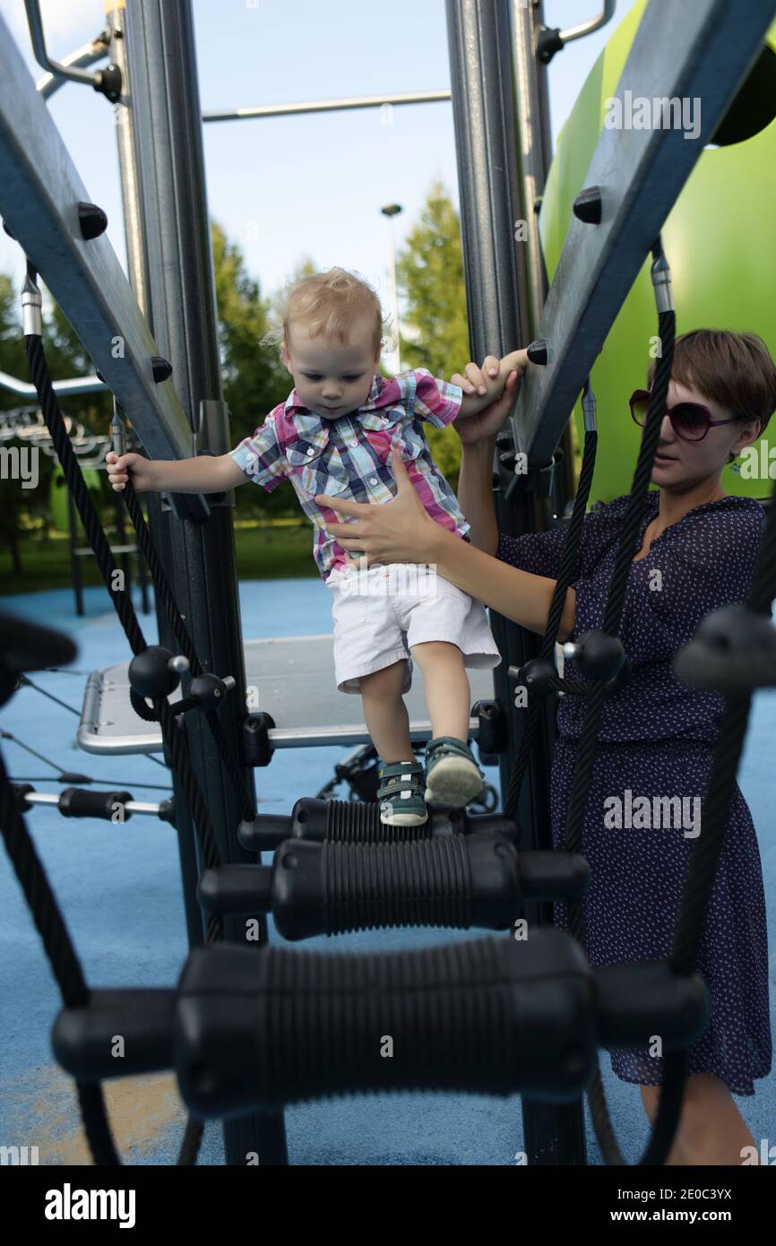 Mother and his son playing at outdoor playground Stock Photo - Alamy
