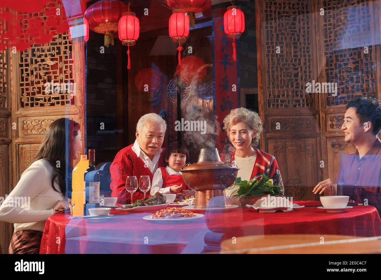 Happy Chinese New Year reunion dinner Oriental families Stock Photo