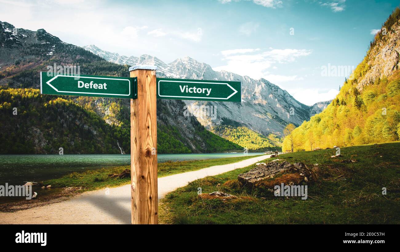 Street Sign the Direction Way to Victory versus Defeat Stock Photo Alamy