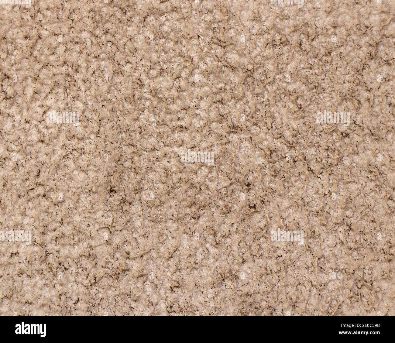 Rough stone wall background, with a rough, beige colored surface Stock ...