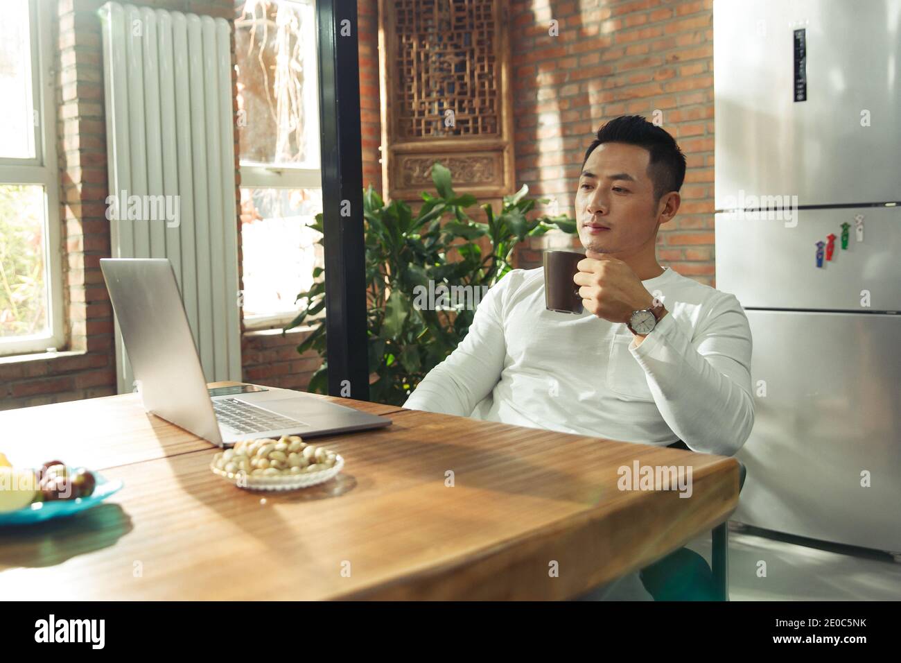 Young men to use a computer at home Stock Photo - Alamy