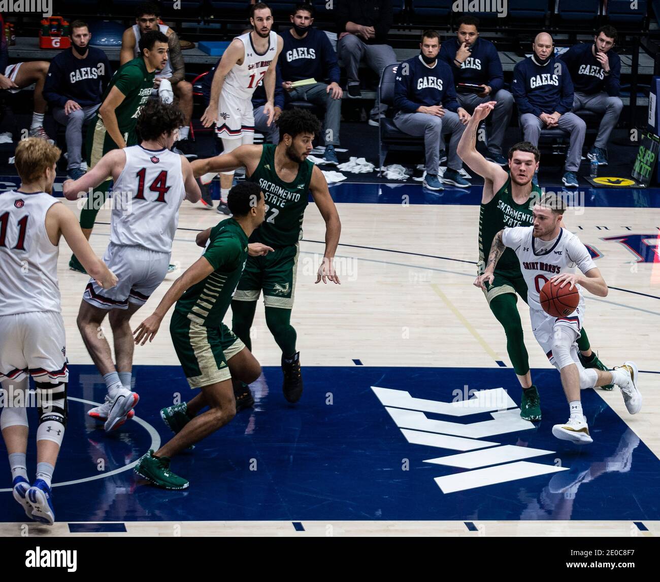 Moraga, CA U.S. 30th Dec, 2020. A. St. Mary's Gaels guard Logan Johnson (0) drives to the hoop during the NCAA Men's Basketball game between Sacramento State Hornets and the Saint Mary's Gaels 63-45 win at McKeon Pavilion Moraga Calif. Thurman James/CSM/Alamy Live News Stock Photo