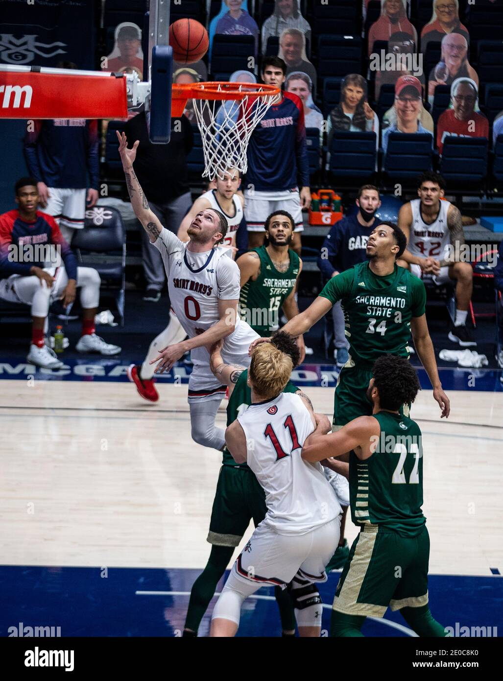 Moraga, CA U.S. 30th Dec, 2020. A. St. Mary's Gaels guard Logan Johnson (0) drives to the hoop during the NCAA Men's Basketball game between Sacramento State Hornets and the Saint Mary's Gaels 63-45 win at McKeon Pavilion Moraga Calif. Thurman James/CSM/Alamy Live News Stock Photo