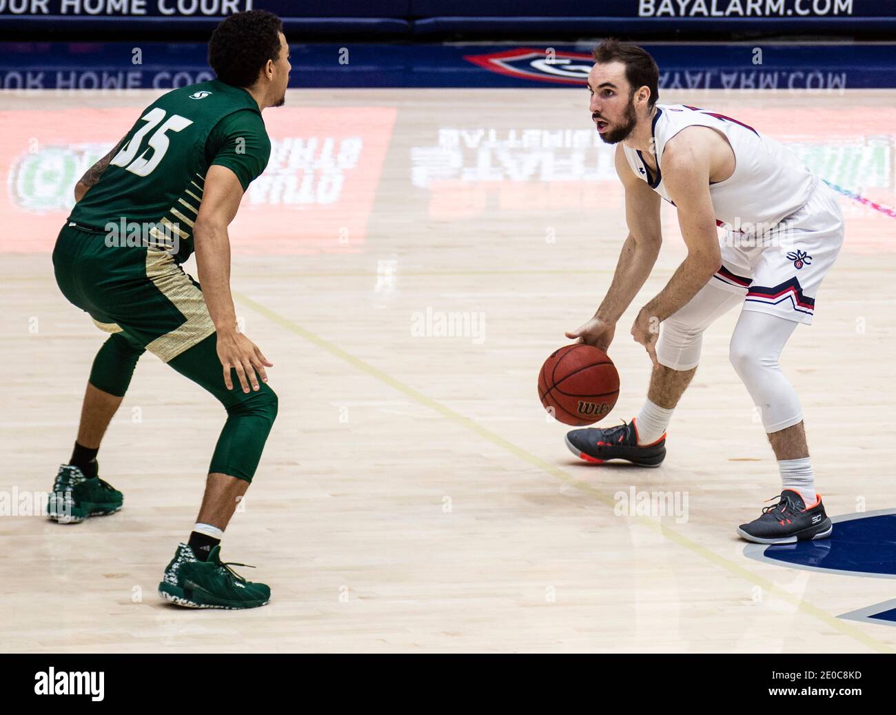 Moraga, CA U.S. 30th Dec, 2020. A. St. Mary's Gaels guard Tommy Kuhse (12) set the play during the NCAA Men's Basketball game between Sacramento State Hornets and the Saint Mary's Gaels 63-45 win at McKeon Pavilion Moraga Calif. Thurman James/CSM/Alamy Live News Stock Photo