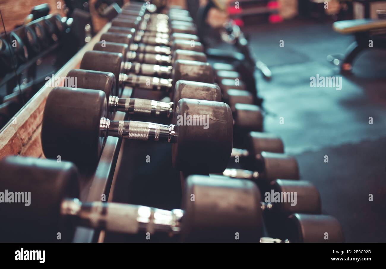 dumbbell rack close-up in the gym Stock Photo - Alamy