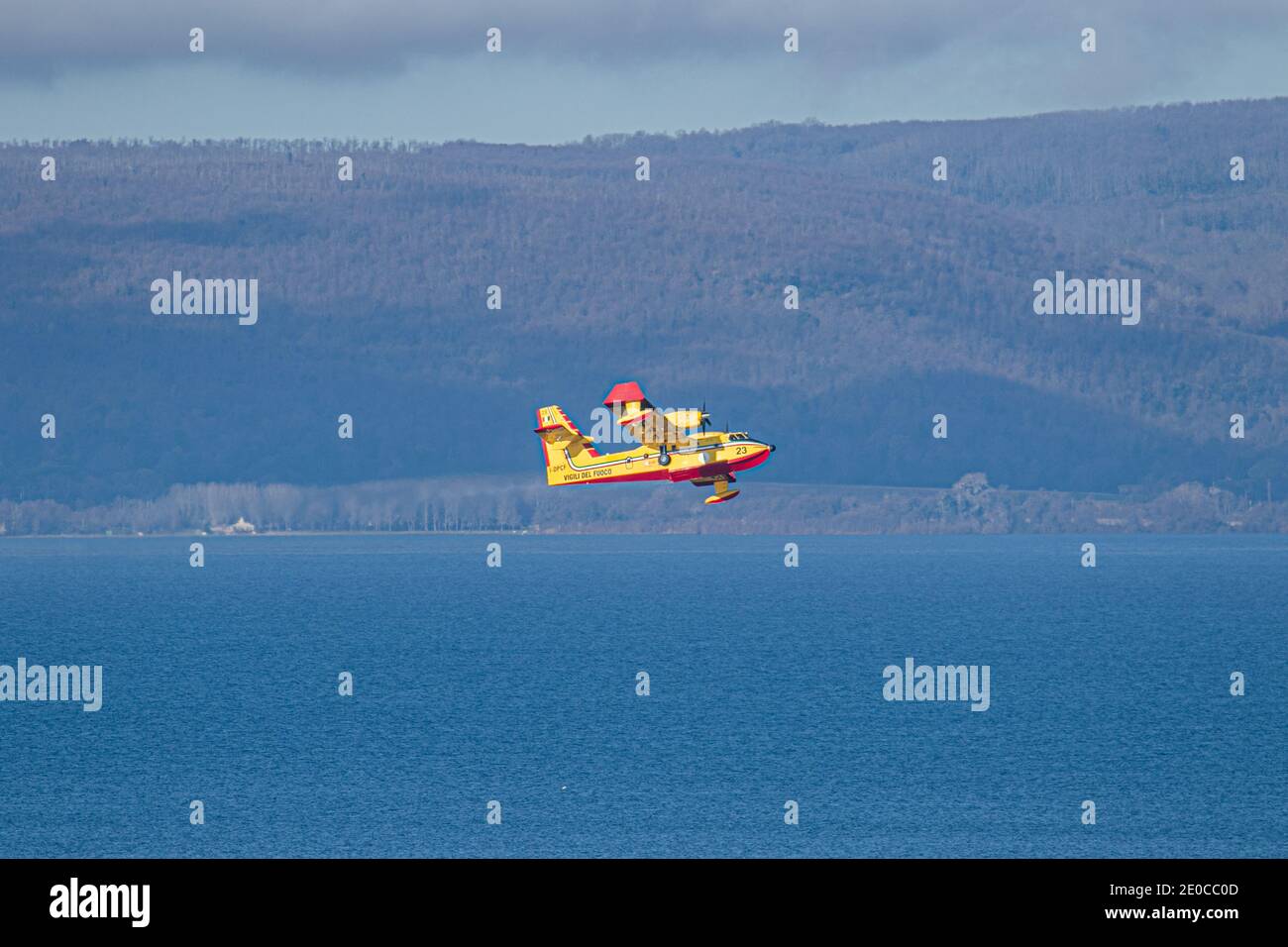 ANGUILLARA SABAZIA, ITALY  31 December 2020. A Bombardier 415 (Canadair CL-415) fire and rescue amphibious water bomber   making practice runs  as it picks up water from  lake Bracciano. Credit: amer ghazzal/Alamy Live News Stock Photo