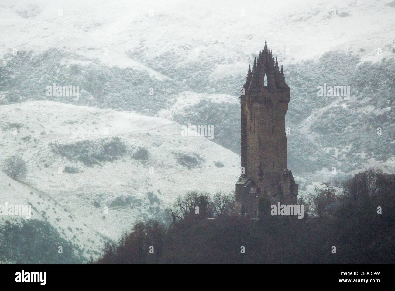 Stirling, Scotland, UK. 31st Dec, 2020. Pictured: The Wallace Monument. Stirling Castle normally has the midnight fireworks display and celebrations to bring in the new year. This year due to the coronavirus (COVID19) pandemic and the national phase 4 lockdown which currently affects the whole of mainland Scotland, means that the celebrations have been cancelled. Organisers have instead showcasing a firework display to be streamed online instead and the fireworks to be set off from the Wallace Monument instead. Credit: Colin Fisher/Alamy Live News Stock Photo