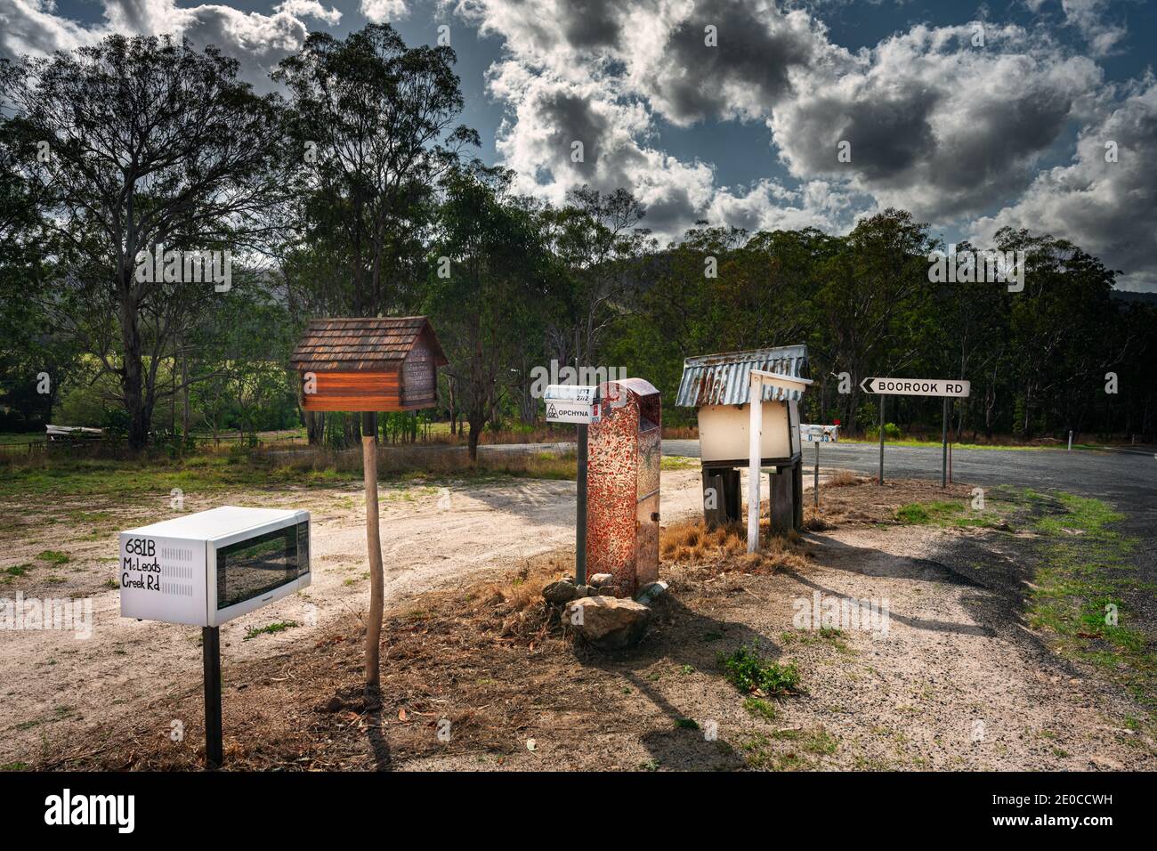 Lined up mail boxes are often to find at the road side in rural Australia. Stock Photo