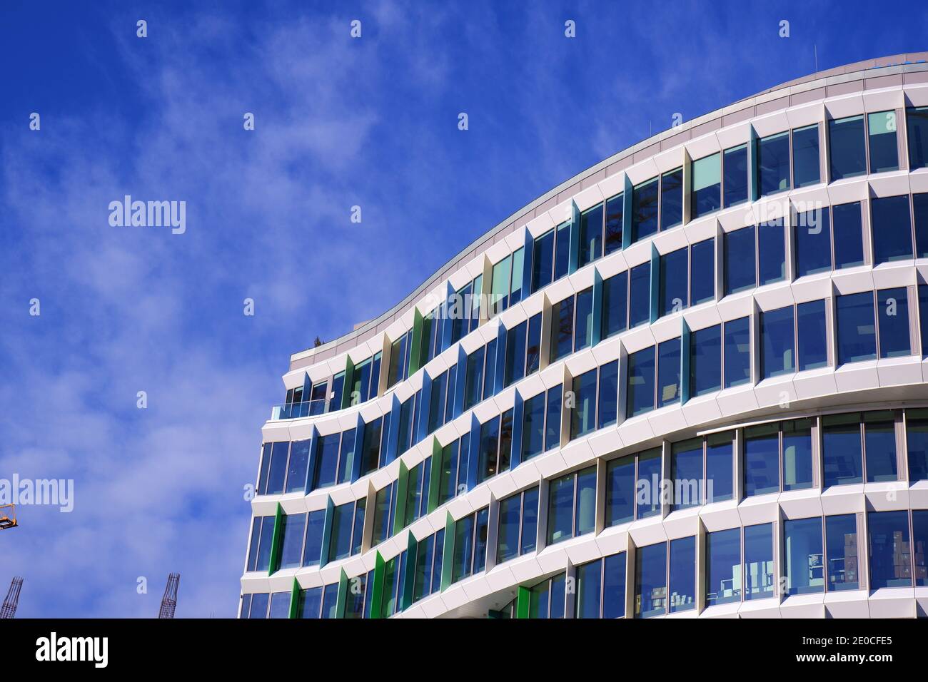 Blue and green colour modern skyscraper building detail with blue ...