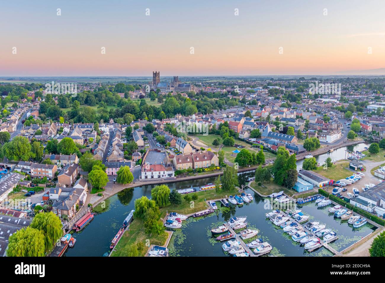 Drone view of Ely Cathedral with Ely Marina and Great Ouse River in foreground, Ely, Cambridgeshire, England, United Kingdom, Europe Stock Photo