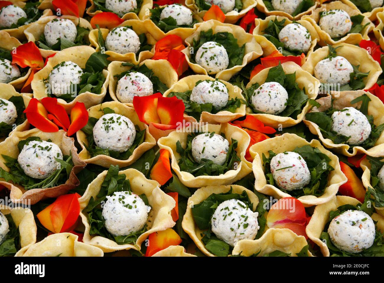 Italy Emilia Romagna Casole Valsenio - exhibition ' Erbe in Fiore' ( herbs in flower ) - Basket of shortcrust pastry with an aromatic sphere with hill cheeses in a mixture of herbs and flowers Stock Photo