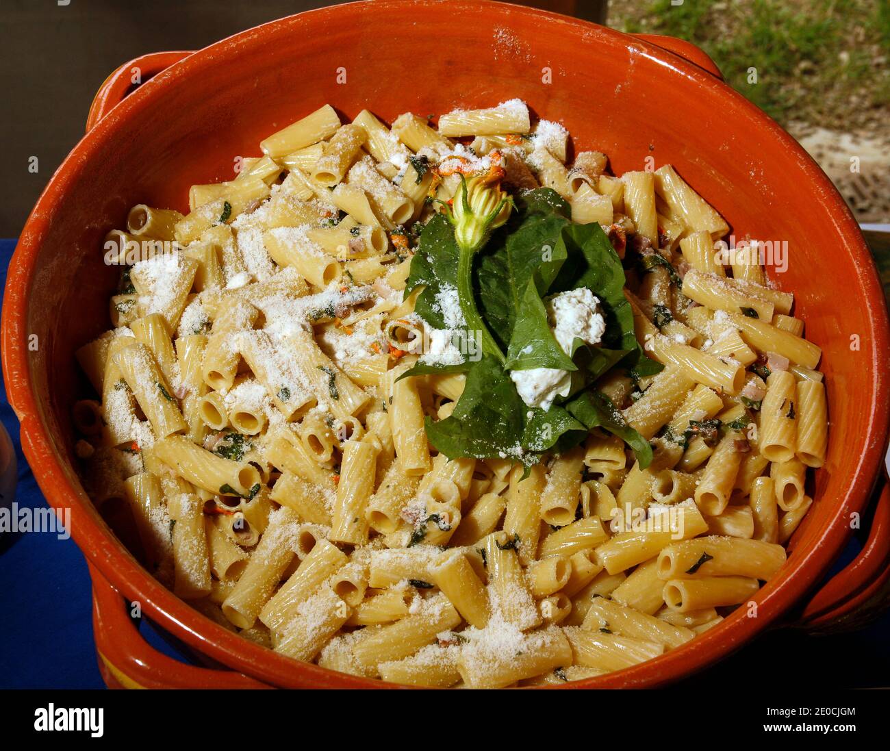 Italy Emilia Romagna Casole Valsenio - exhibition ' Erbe in Fiore' ( herbs in flower ) - Rigatoni with courgette flowers, Dandelion, and herb cheese from the officinal garden Stock Photo