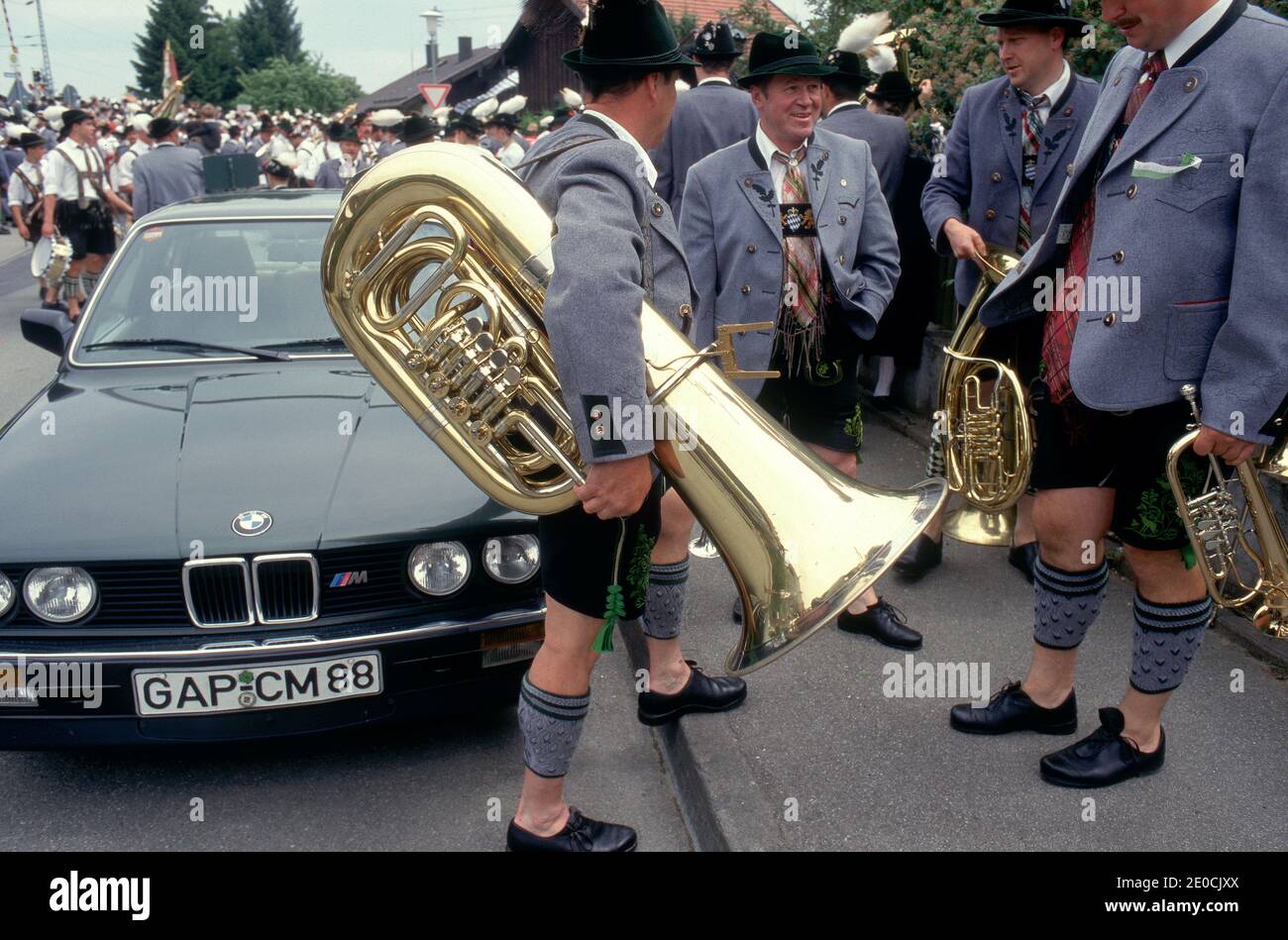 Germany  / Bavaria / Garmisch Partenkirchen / Man  wearing traditional bavarian clothes with instruments havening a break during the Bier- festival Stock Photo