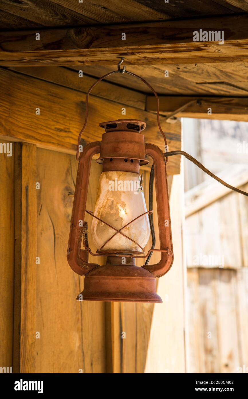 Oil lamp hanging from the ceiling on a ranch in the Mojave Desert Stock Photo