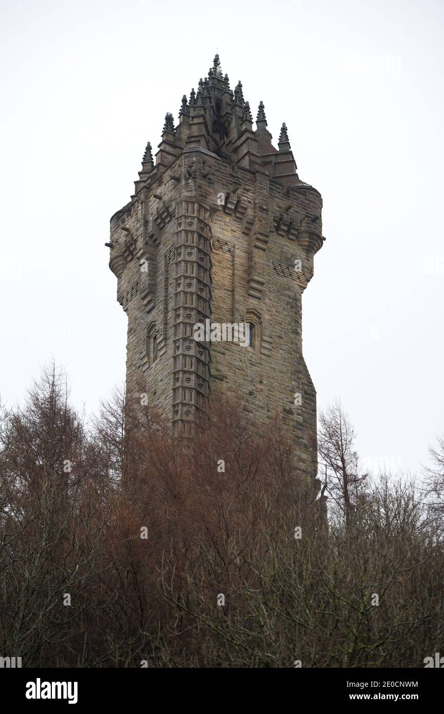 Stirling, Scotland, UK. 31st Dec, 2020. Pictured: Wallace Monument. Pyrotechnic experts from 21CC Fireworks, an Edinburgh based events company, carefully load the mortar shells into their launch tubes as they prepare for this evenings Hogmanay pyro spectacular which will light up the sky 600ft above the Wallace Monument. A light show projected onto the facade of the Wallace Monument will accompany the fireworks. Due to the coronavirus (COVID19) pandemic the show will be live streamed on TV and online since Scotland is in phase 4 lockdown. Credit: Colin Fisher/Alamy Live News Stock Photo
