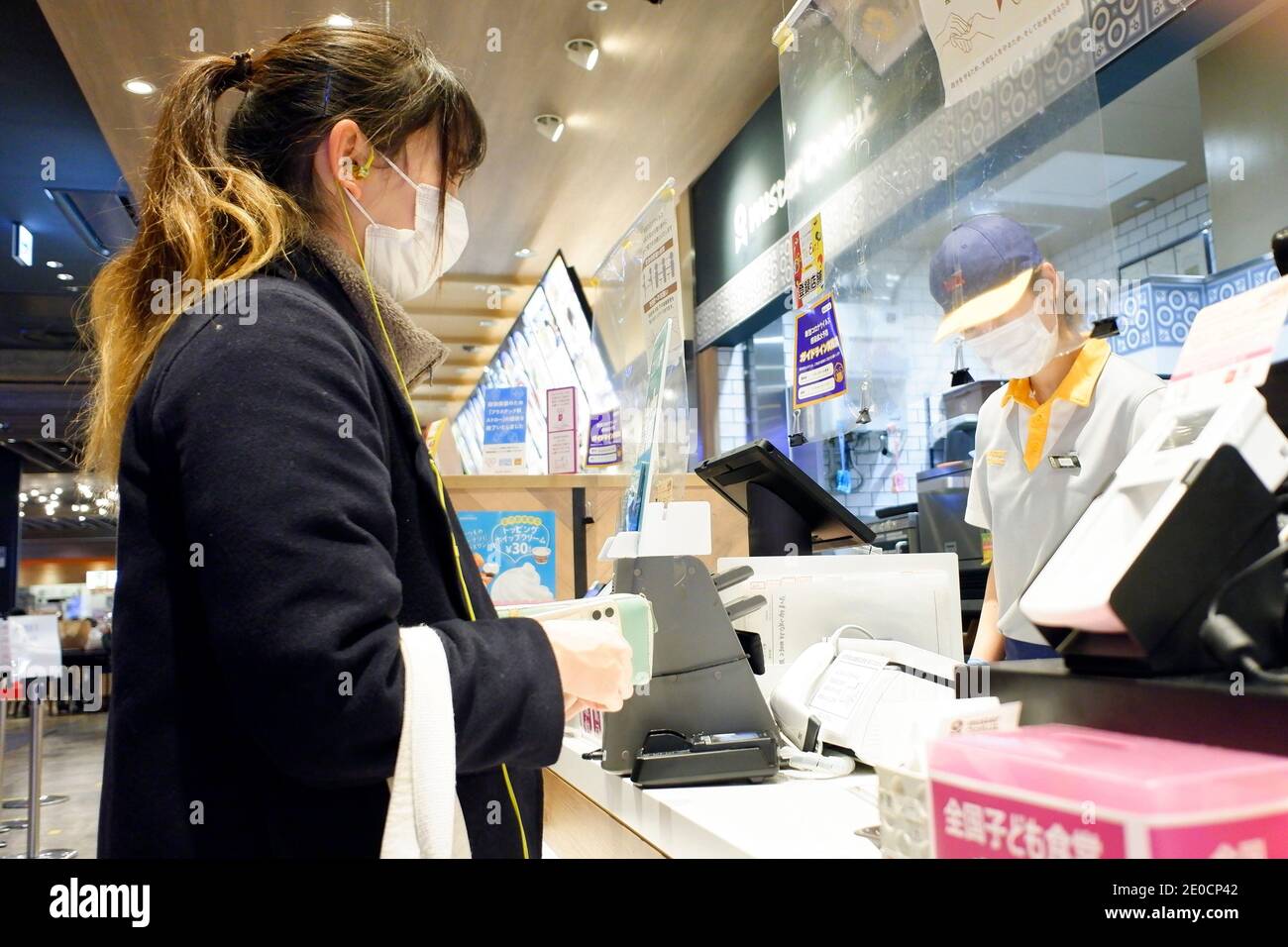 Tokyo, Japan. 31st Dec, 2020. A woman wearing face mask as a preventive measure while shopping at the AEON Shopping Mall amid Coronavirus (COVID-19) crisis. The daily number of coronavirus infections totaled 1,337 in Tokyo on Thursday, metropolitan government officials said, exceeding the 1,000 mark for the first time since the pandemic began earlier this year and deepening concerns about hospital capacity. (Photo by Michele Sawada/Sipa USA) Credit: Sipa USA/Alamy Live News Stock Photo