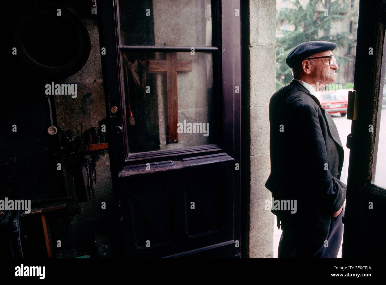 Spain/Santiago de Compostela/ Old man is waiting in front of his shop Stock Photo