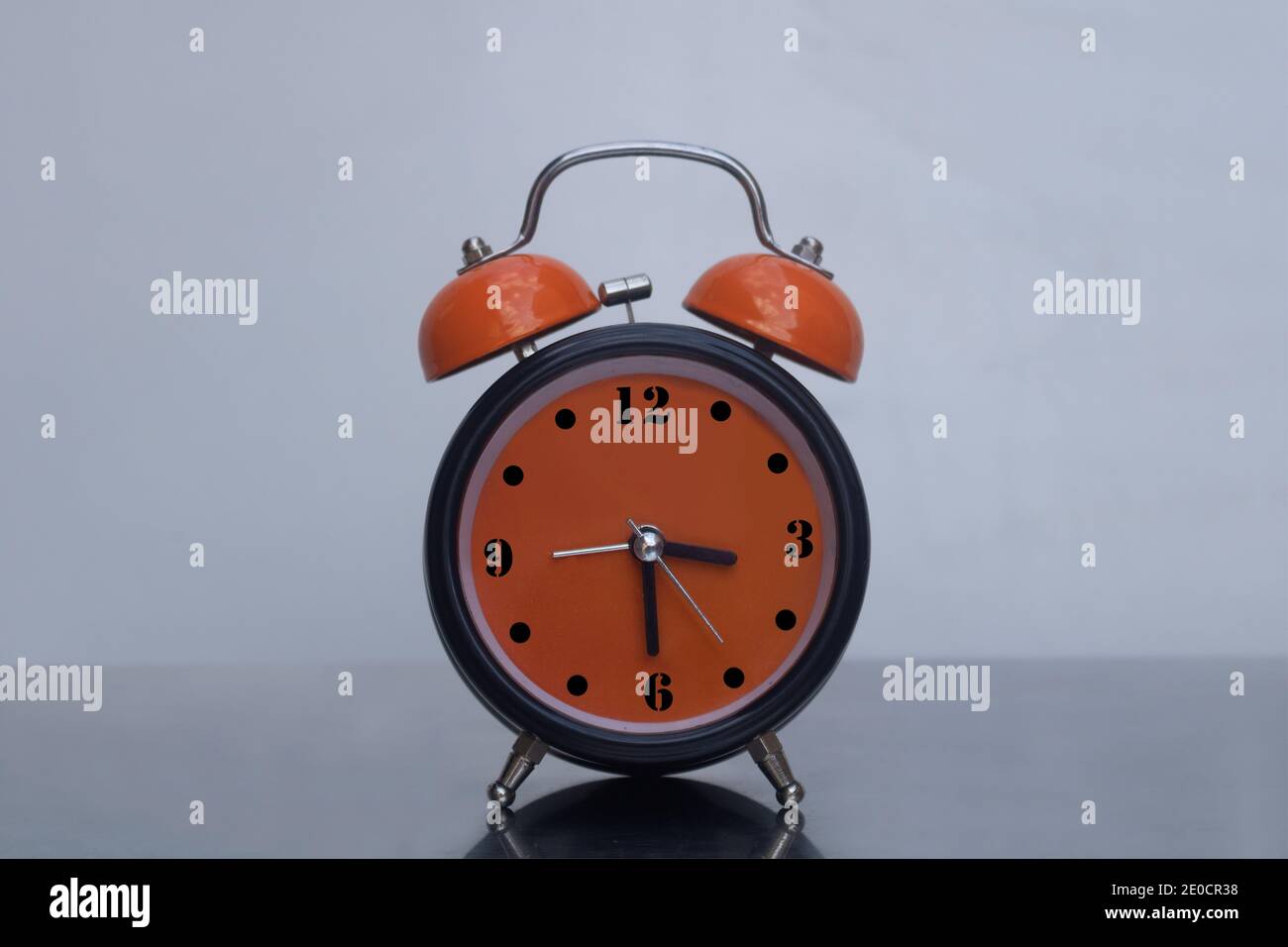 Retro style alarm clock brought to life with trendy vivid colors Stock