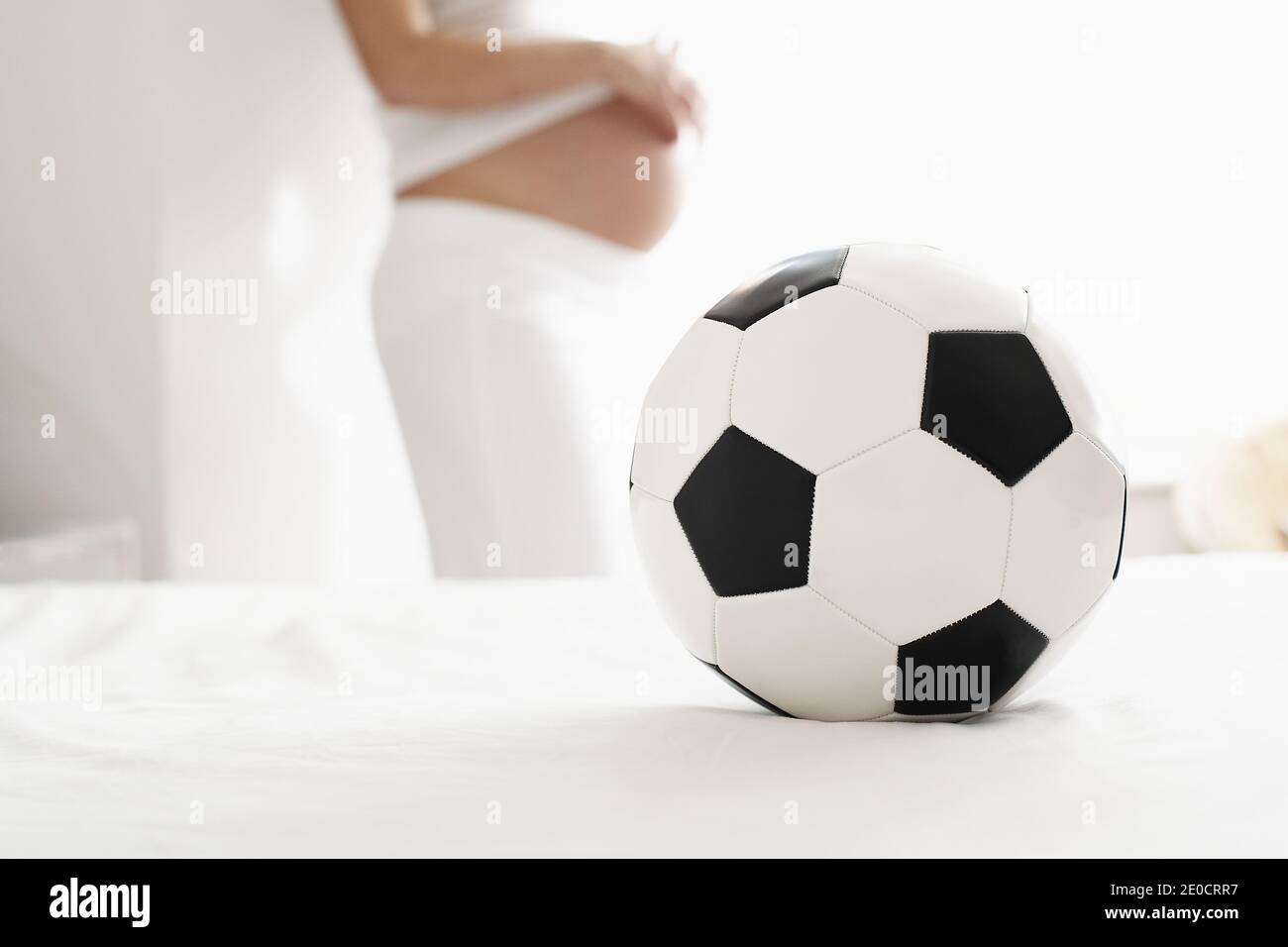 https://c8.alamy.com/comp/2E0CRR7/great-britain-england-london-soccerball-with-pregnant-woman-profile-defocussed-2E0CRR7.jpg