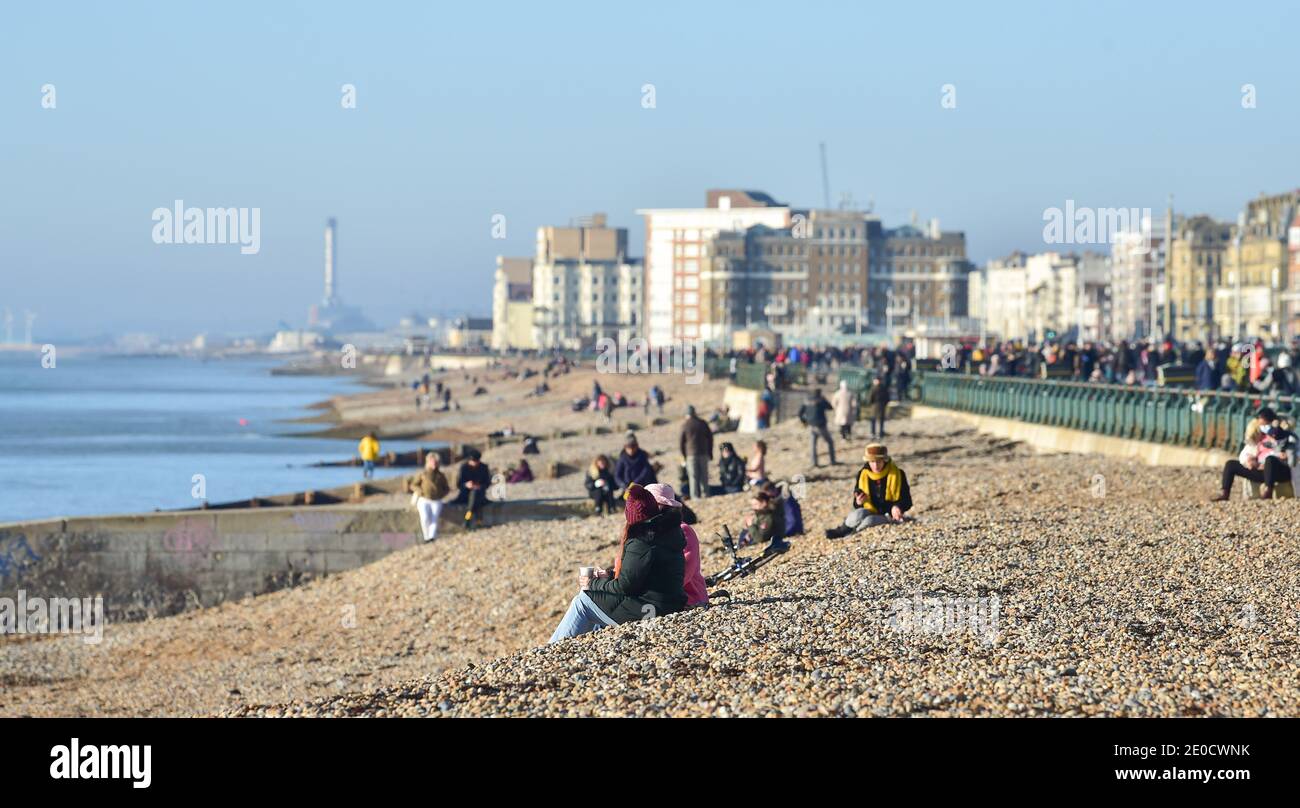 Brighton UK 31st December 2020 Visitors enjoy the sunny but cold