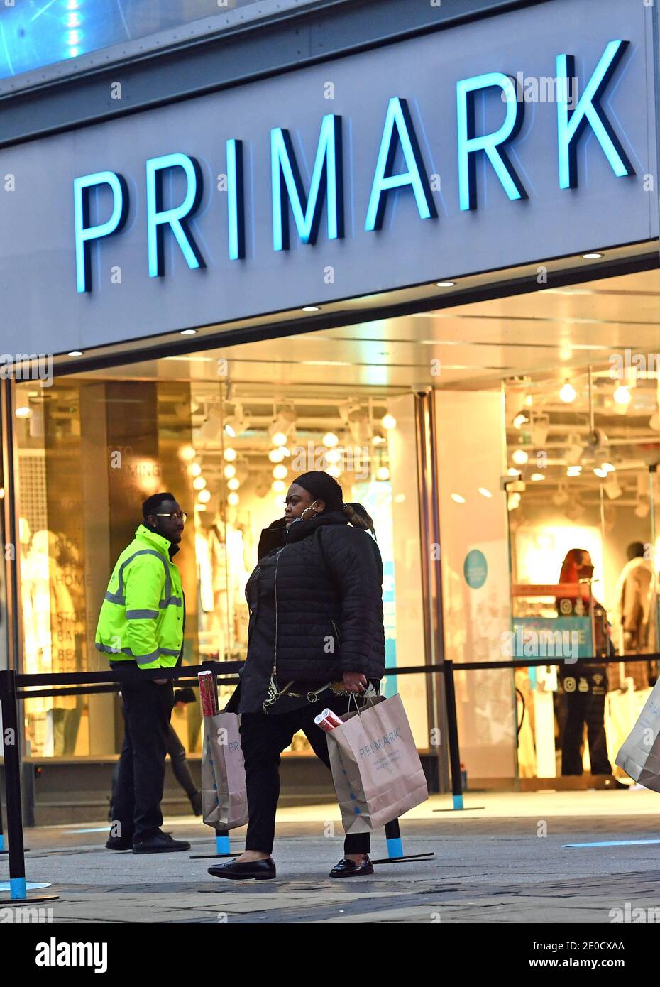 File photo dated 2/12/2020 of a shopper leaving Primark in Birmingham. Primark owner Associated British Foods (ABF) has said it will face a £650 million hit from Covid-19 after tougher restrictions in the UK and Ireland forced more stores to close. Stock Photo