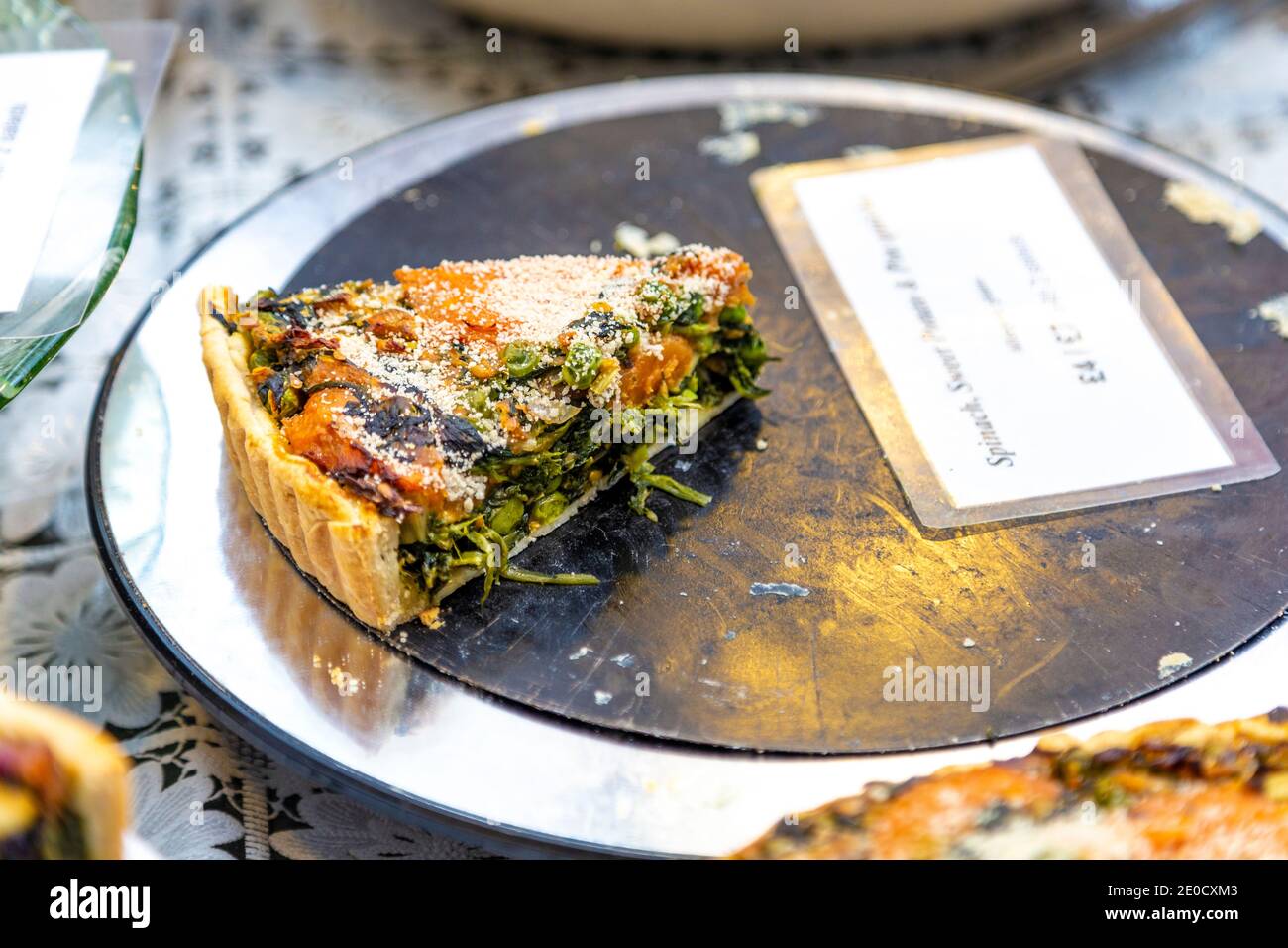 Slice of spinach and sweet potato pie at Greenwich Market, London, UK Stock Photo