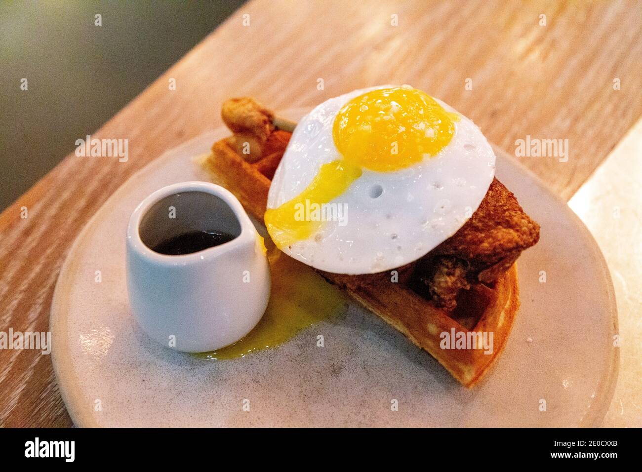 Duck leg, waffle, egg and maple syrup at Duck and Waffle Local in