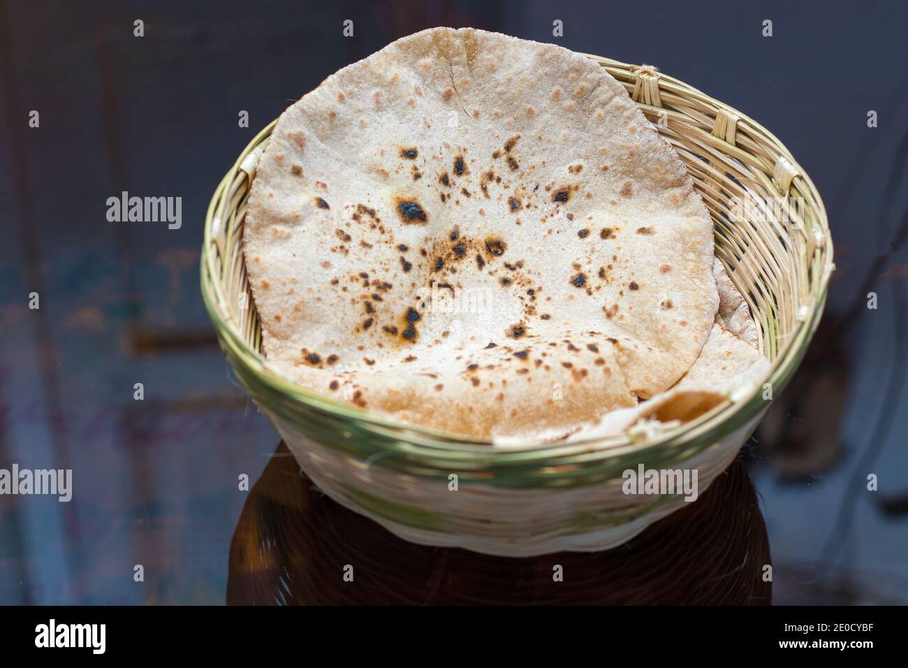 selective focus of Indian bread Roti or Chapati with a hand made bamboo basket. Stock Photo