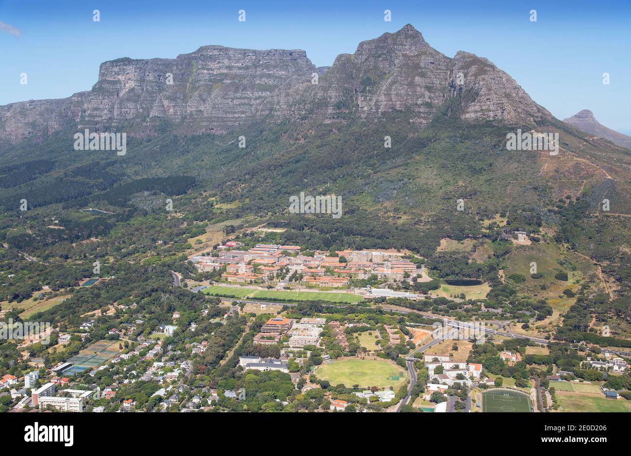 Cape Town, Western Cape, South Africa - 12.22.2020: Air-to-air photo of University of Cape Town with Table Mountain, Rhodes Memorial and Lions Head in Stock Photo