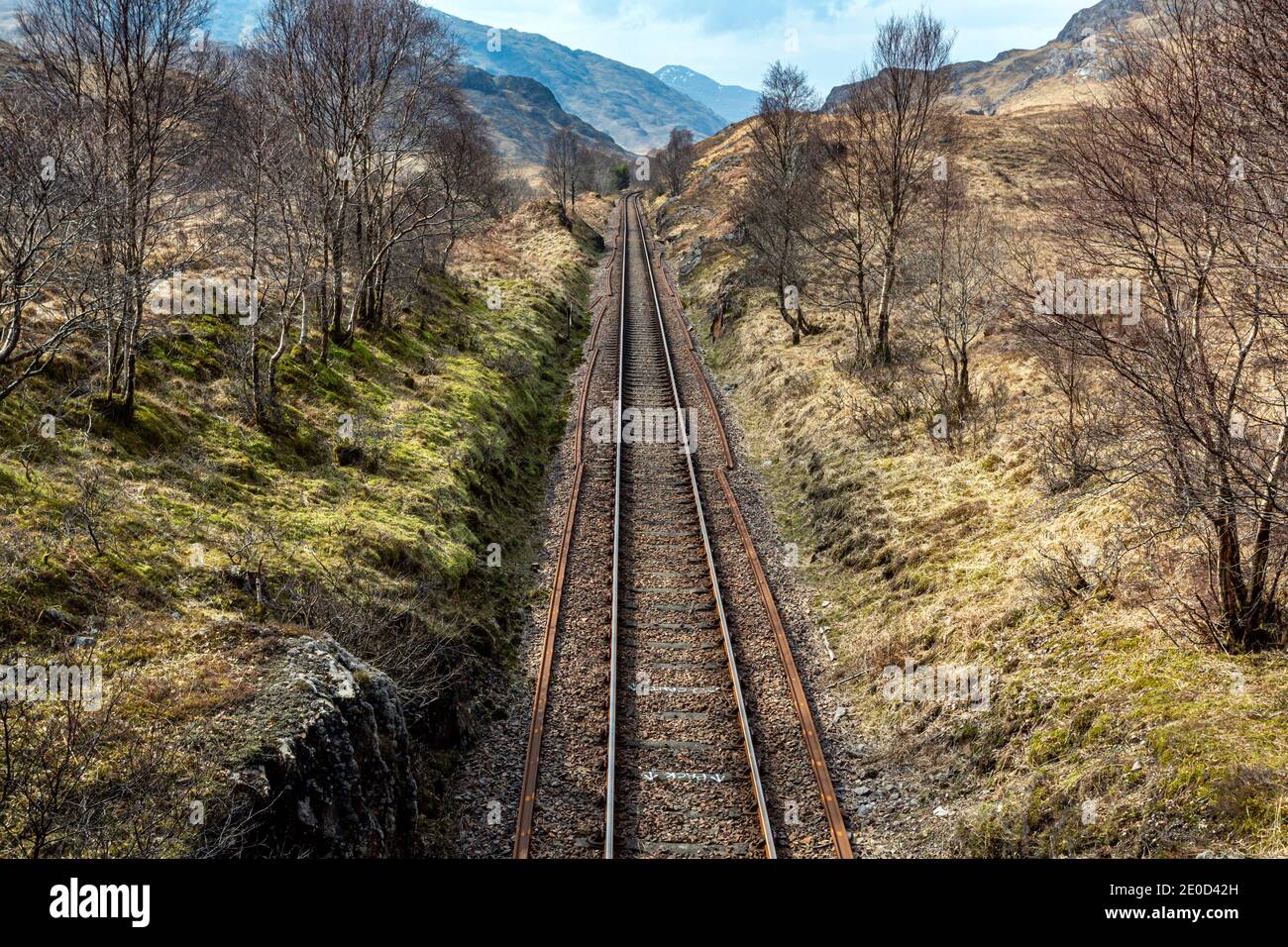Railway tracks running through the Scottish Highlands towards Glenfinnan Stock Photo