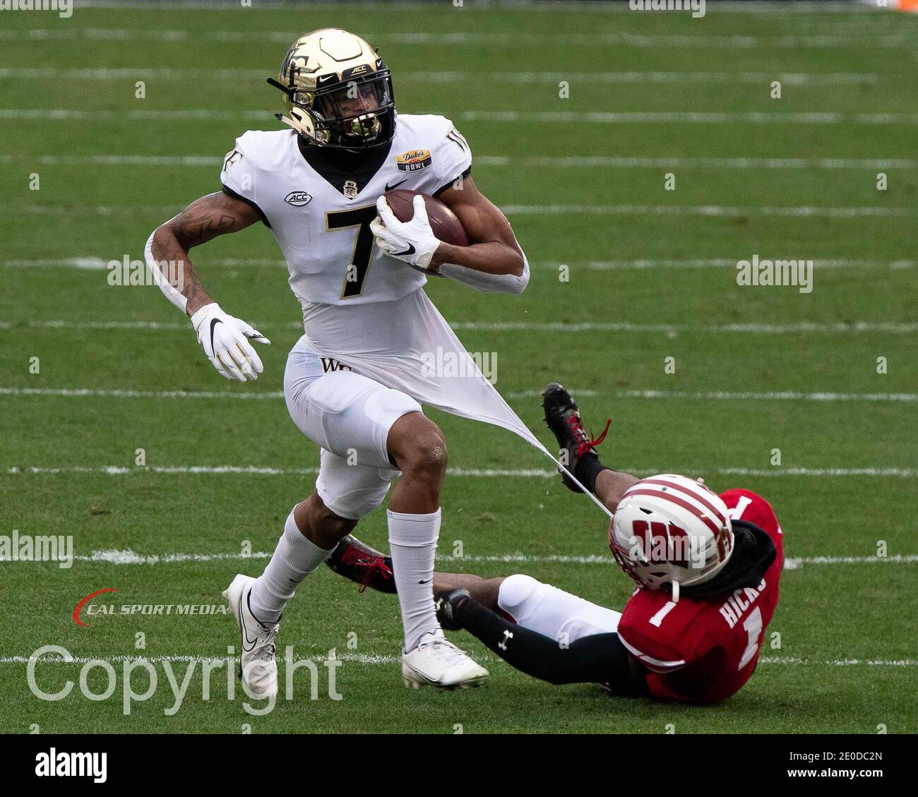 December 30, 2020: Wake Forest WR Donavon Greene (7) breaks away from Wisconsin CB Faion Hicks (1) during the DukeÕs Mayo Bowl football game between the Wake Forest Demon Deacons and the Wisconsin Badgers at Bank of America Stadium in Charlottesville, VA. Brian McWalters/CSM Stock Photo