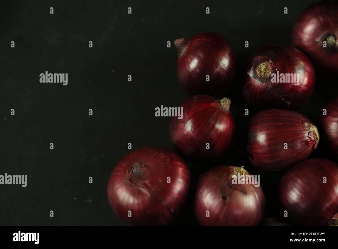 sweet red onions on background Stock Photo