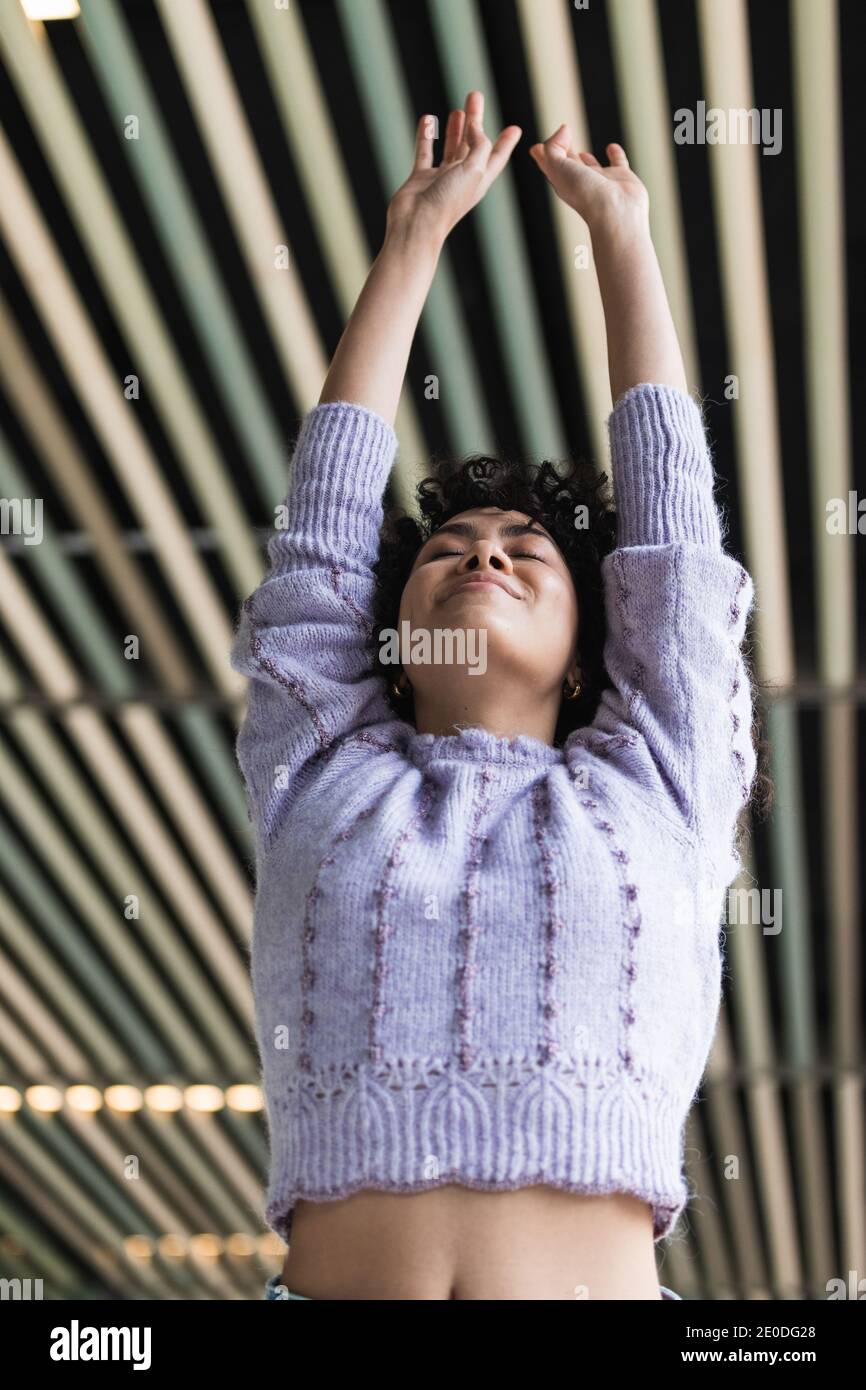 Playful black female with Afro hairstyle standing in street with flipping hair and smiling charmingly at camera Stock Photo - Alamy Playful black female with Afro hairstyle standing in street with flipping hair and smiling charmingly at camera Stock Photo - Alamy