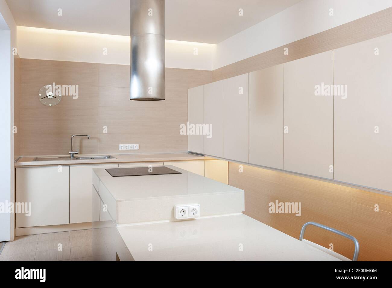 Modern kitchen minimalictic interior with beige artificial stone pannels. Kitchen design concept Stock Photo