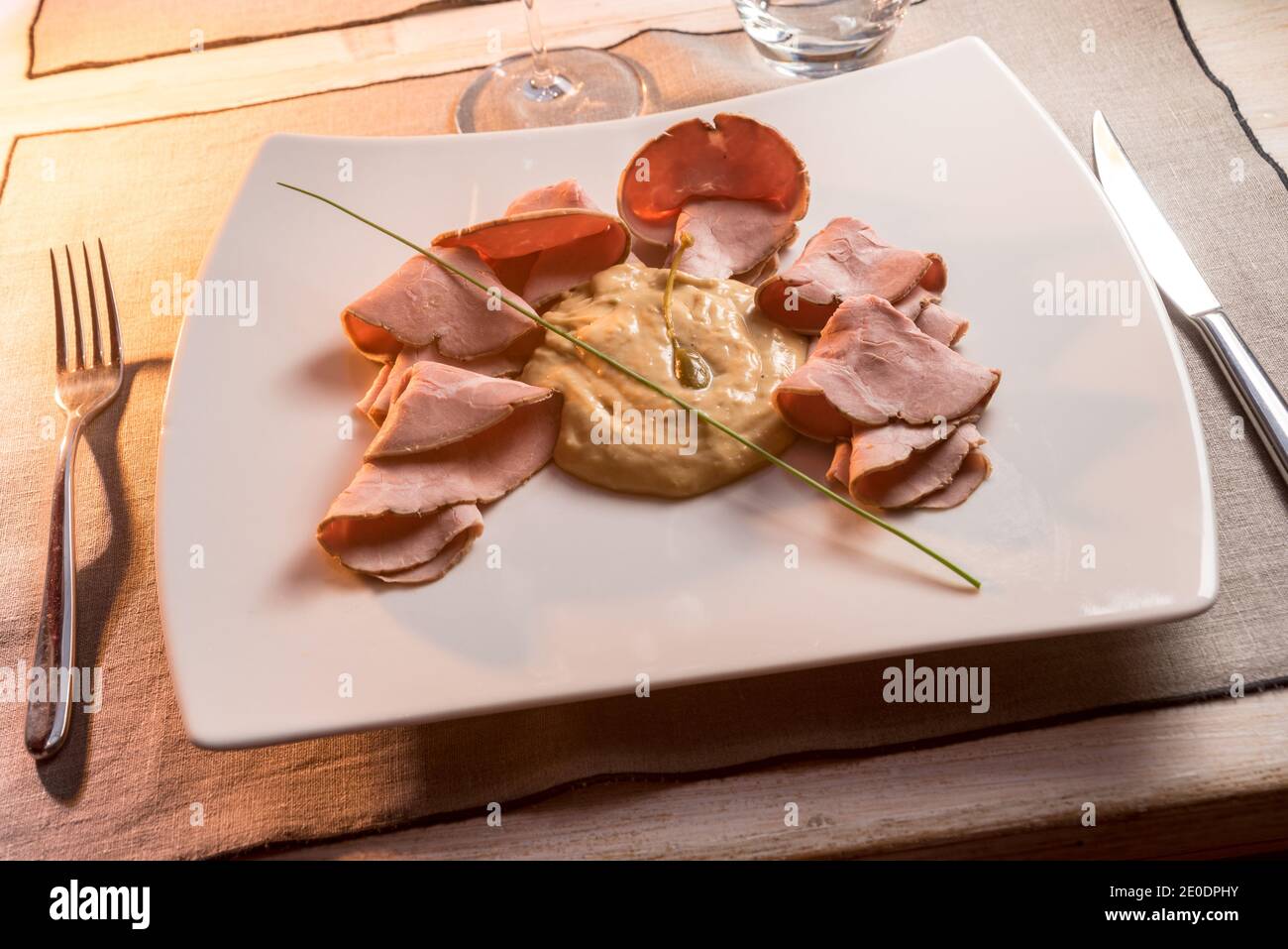 Typical italian dish with veal and tuna hires stock photography and