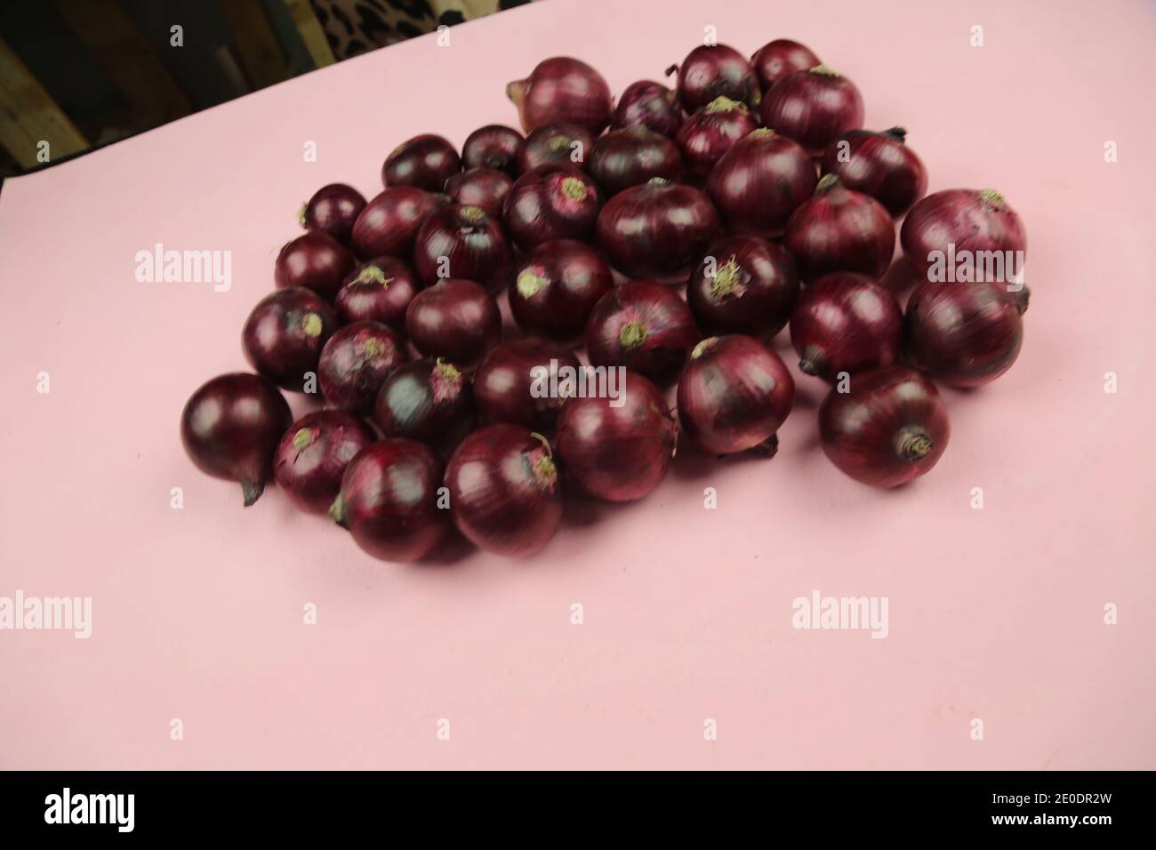 sweet red onions on background Stock Photo