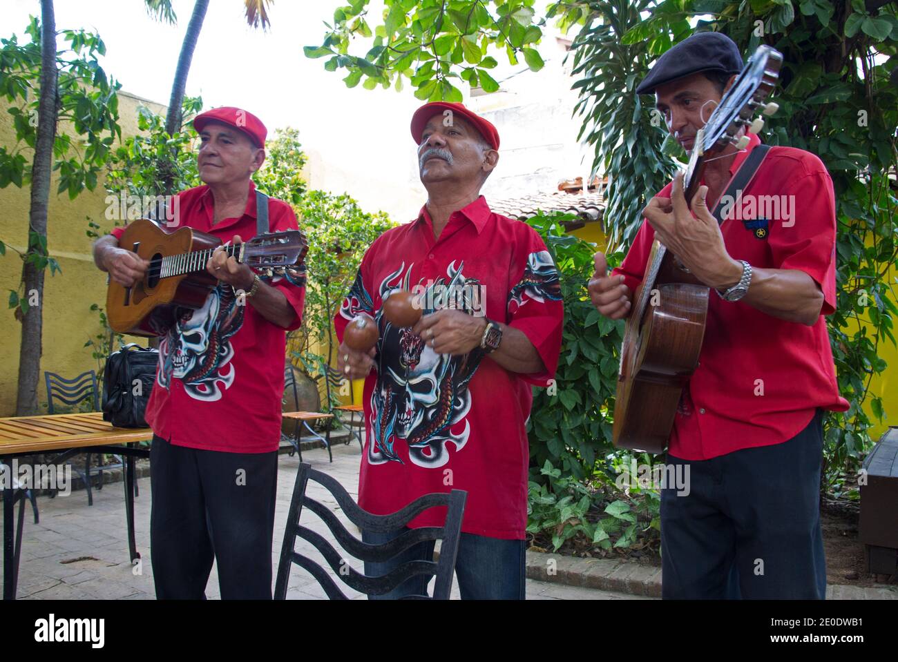 Musicians playing guitars, maracas and singing, Camaguey, Cuba Stock Photo