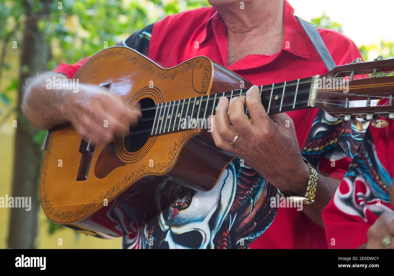 Close-up of musician playing guitar, Camaguey, Cuba Stock Photo