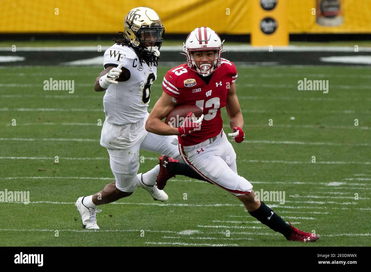Charlottesville, VA, USA. 30th Dec, 2020. Wake Forest DB Ja'Sir Taylor (6) chases Wisconsin WR