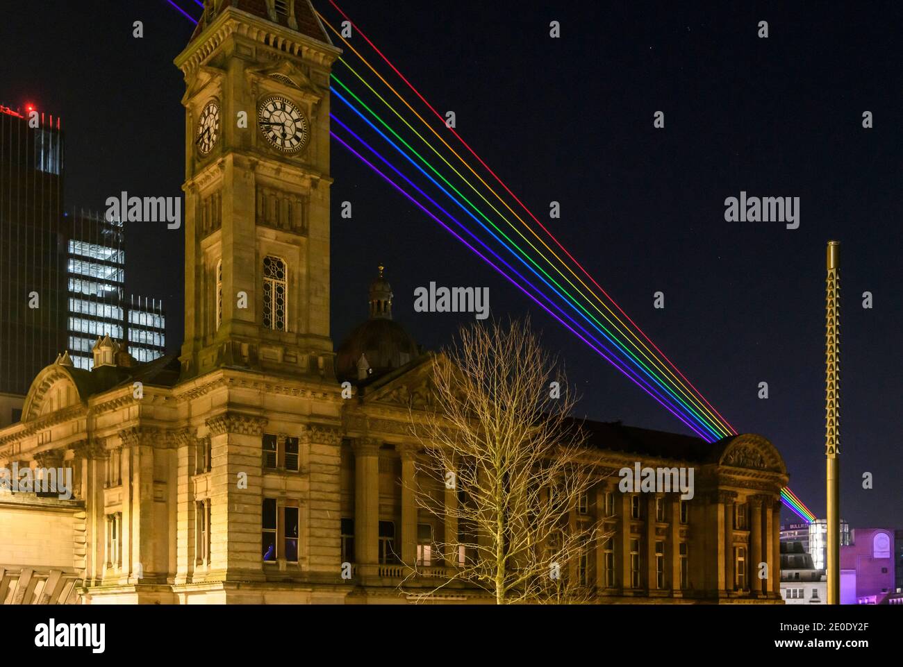 Birmingham, UK. 31 December 2020. Global Rainbow C an art installation by international artist Yvette Mattern - was beamed Northwest from the city's iconic Rotunda building this evening, marking a message of hope and peace for the New Year. The picture shows the view across the city from the top of the Rotunda. Global Rainbow beams seven rays of laser light (Red, Orange, Yellow, Green, Blue, Indigo and Violet) representing the colour spectrum of a natural rainbow and will be shone northwest out the city over the New Year period. Credit: Simon Hadley/Alamy Live News Stock Photo