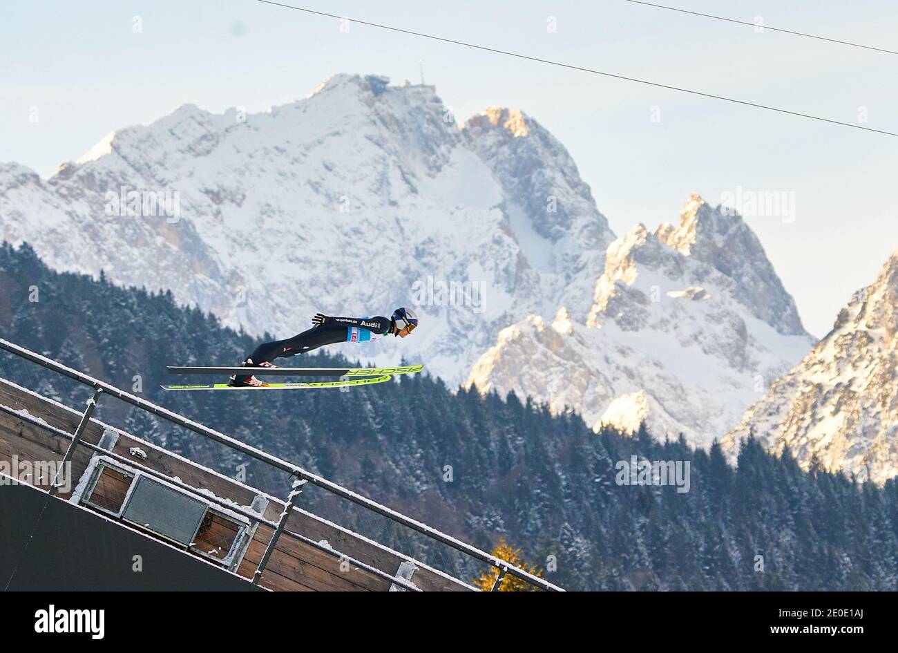 In front of Zugspitze mountain: Andreas WELLINGER, GER in action at the Four Hills Tournament Ski Jumping at Olympic Stadium, Grosse Olympiaschanze in Garmisch-Partenkirchen, Bavaria, Germany, December 31, 2020.  © Peter Schatz / Alamy Live News Stock Photo