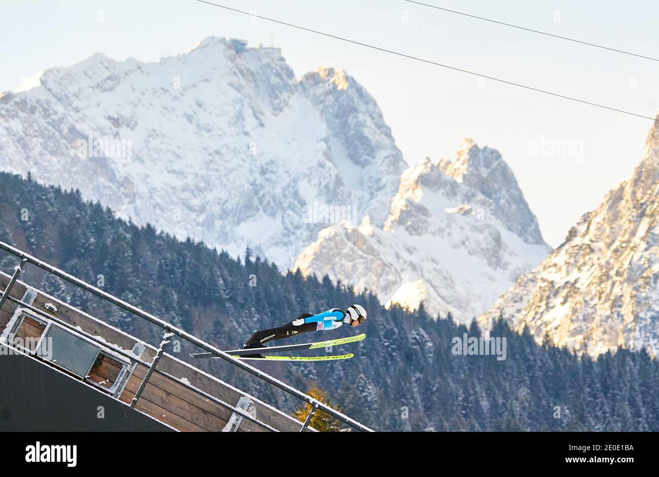 In front of Zugspitze mountain: Simon AMMANN, SUI in action at the Four Hills Tournament Ski Jumping at Olympic Stadium, Grosse Olympiaschanze in Garmisch-Partenkirchen, Bavaria, Germany, December 31, 2020.  © Peter Schatz / Alamy Live News Stock Photo