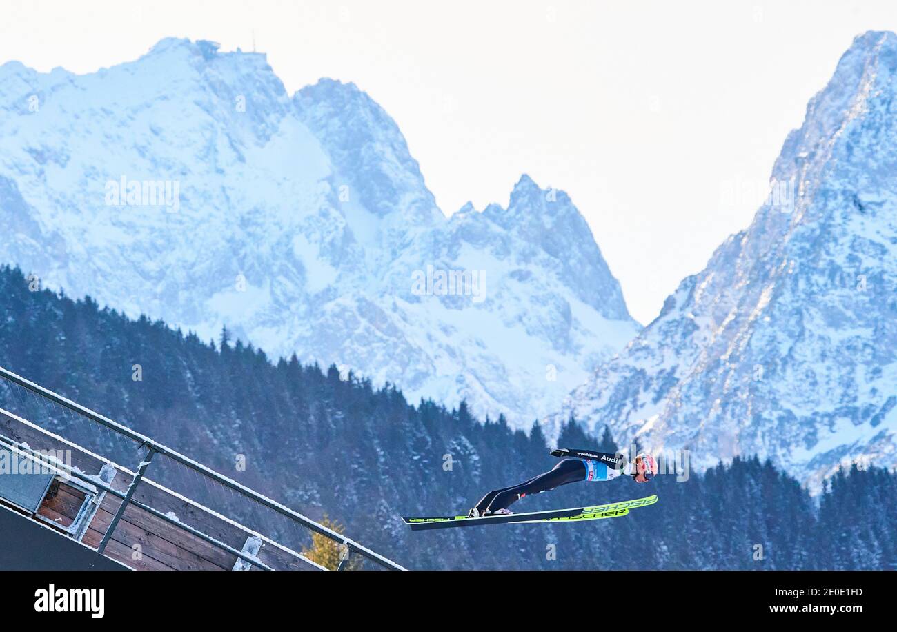 Karl GEIGER, GER  in action in front of Zugspitze mountain at the Four Hills Tournament Ski Jumping at Olympic Stadium, Grosse Olympiaschanze in Garmisch-Partenkirchen, Bavaria, Germany, December 31, 2020.  © Peter Schatz / Alamy Live News Stock Photo