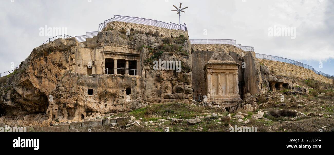 Jerusalem, Israel - December 17th, 2020: Ancient tombs and burial caves around the tombs of the sons of Hezir and of Zechariah, in the Kidron valley, Stock Photo