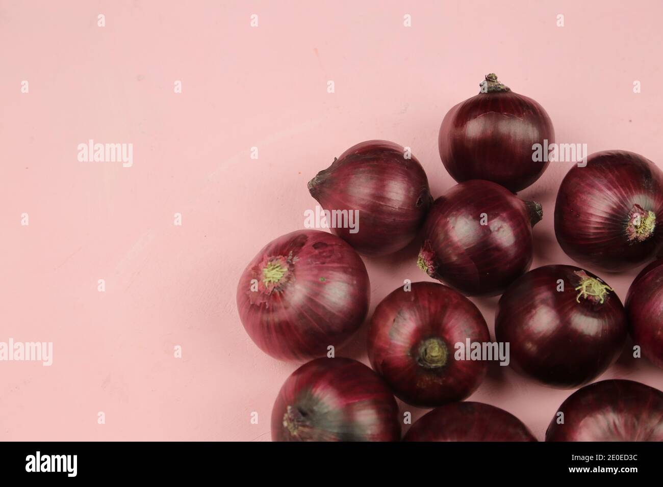 sweet red onions on background Stock Photo