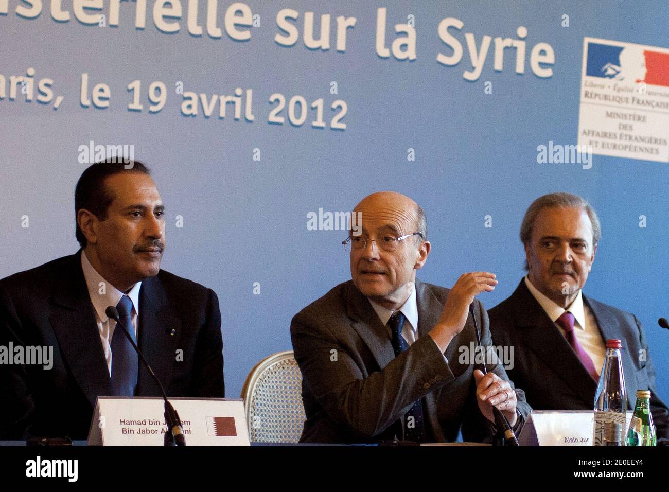 Qatar's Prime Minister and Minister of Foreign Affairs Sheikh Hamad bin Jassim al-Thani, France's Foreign Affairs minister Alain Juppe (C) and Saudi Arabia's Foreign Minister Prince Saud al-Faisal take part to a meeting with Western and Arab foreign ministers focused on the Syria crisis, with France warning Russia that its refusal to attend was plunging it deeper into isolation, at the ministry of Foreign Affairs, in Paris, France, on April 19, 2012. Photo by Stephane Lemouton/ABACAPRESS.COM Stock Photo