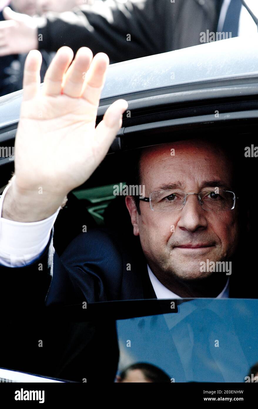Socialist presidential hopeful Francois Hollande waves to supporters from his car as he leaves the Jean Gautherin cemetery in Nevers, central France, after paying tribute in front of Pierre Beregovoy's grave, on May 1, 2012. Photo by Thierry Orban/ABACAPRESS.COM Stock Photo