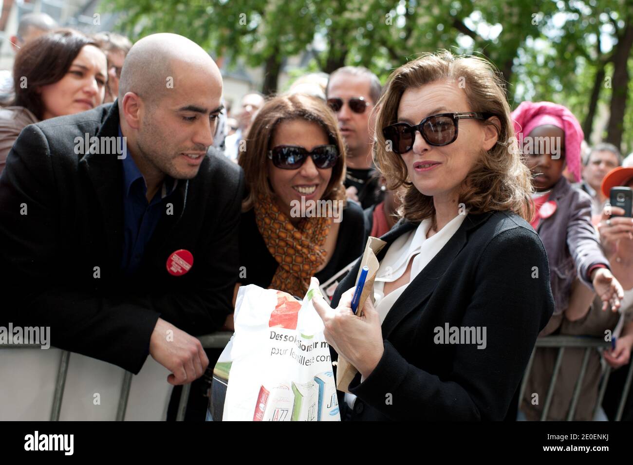 Journalist and Francois Hollande's partner Valerie Trierweiler (R) signs autographs to supporters upon her arrival at a PS campaign meeting, in Nevers, central France, on May 1, 2012. Photo by Thierry Orban/ABACAPRESS.COM Stock Photo