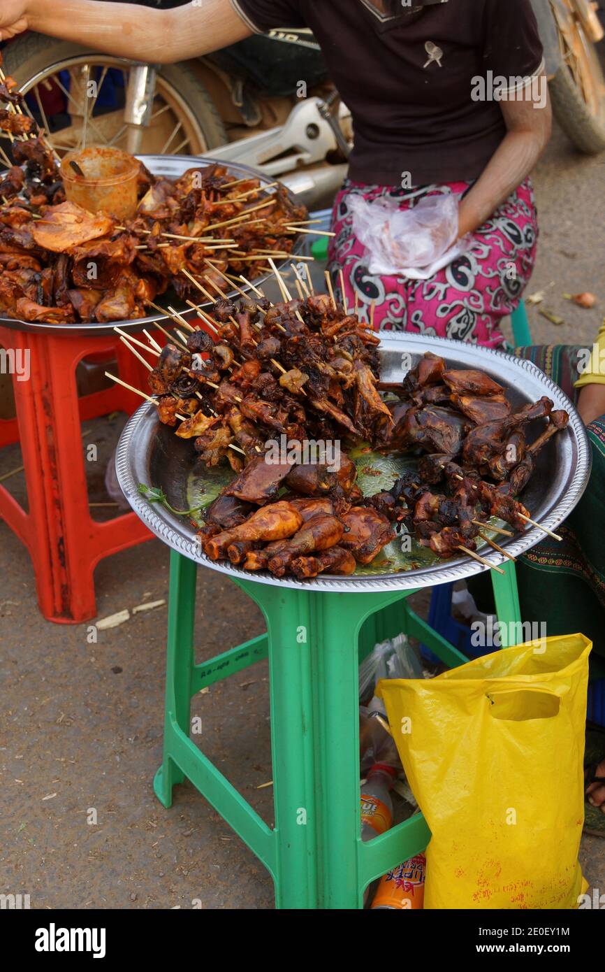 Skewers of  barbequed chicken at the street market in Kyaukme Myanmar (Burma) Stock Photo